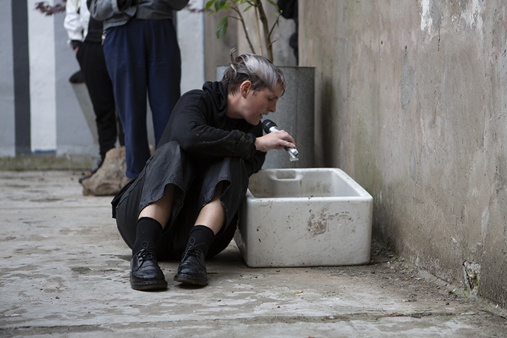 I'm sitting in the ground reading from inside a basin
